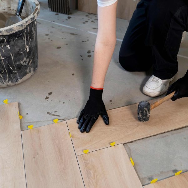 high-angle-worker-tiling-floor
